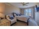 Bedroom featuring a bed, chair, and a view from the window at 2071 S Atlantic Ave # 201, Daytona Beach Shores, FL 32118