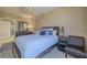 Bedroom featuring a bed, nightstand, and a chair at 2071 S Atlantic Ave # 201, Daytona Beach Shores, FL 32118