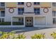 Building entrance showing covered entry with columns and surrounding landscaping at 2071 S Atlantic Ave # 201, Daytona Beach Shores, FL 32118