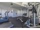 Community gym with machines, free weights, and mirrored wall at 2071 S Atlantic Ave # 201, Daytona Beach Shores, FL 32118