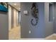 Hallway with multiple doors and a decorative seahorse at 2071 S Atlantic Ave # 201, Daytona Beach Shores, FL 32118