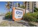 Opus Condominium sign welcomes you to this beachfront property with lush landscaping at 2071 S Atlantic Ave # 201, Daytona Beach Shores, FL 32118