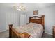 Bedroom with wood bed frame and ceiling fan at 45 San Jose Dr, Ormond Beach, FL 32176