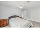 Bedroom with wood dresser and ceiling fan at 45 San Jose Dr, Ormond Beach, FL 32176