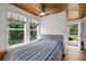 Bedroom with backyard access and wood ceiling at 45 San Jose Dr, Ormond Beach, FL 32176