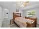Bedroom with wood furniture and access to the bathroom at 45 San Jose Dr, Ormond Beach, FL 32176