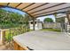 Hot tub with pergola cover and bar seating at 45 San Jose Dr, Ormond Beach, FL 32176