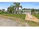 White single-story home with lush landscaping and driveway at 45 San Jose Dr, Ormond Beach, FL 32176