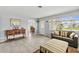 Living room with tiled floors, sofas, and access to other rooms at 45 San Jose Dr, Ormond Beach, FL 32176