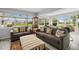 Bright sunroom with ample seating and large windows offering scenic views at 45 San Jose Dr, Ormond Beach, FL 32176
