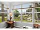 Sunroom features a view of the waterway and tropical landscaping at 45 San Jose Dr, Ormond Beach, FL 32176