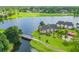 Picturesque lakefront condos with fountain view, bridge and lush landscaping on golf course at 1128 Kilkenny Ln, Ormond Beach, FL 32174