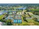 Beautiful aerial featuring tennis courts, clubhouse, pool and waterways at 1128 Kilkenny Ln, Ormond Beach, FL 32174