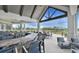 Spacious outdoor bar area with seating overlooking the golf course and beautiful views at 1128 Kilkenny Ln, Ormond Beach, FL 32174