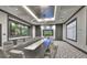 Modern conference room with a large table, stylish chairs, and elegant decor at 1128 Kilkenny Ln, Ormond Beach, FL 32174