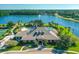 Beautiful community clubhouse overlooking a sparkling pool and serene lake at 1128 Kilkenny Ln, Ormond Beach, FL 32174