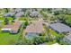 Aerial view of home showing fenced yard, pool, and tropical landscaping at 3 Seabridge Dr, Ormond Beach, FL 32176