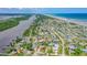 Aerial view of a waterfront community with houses near the ocean at 3 Seabridge Dr, Ormond Beach, FL 32176