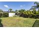 Spacious backyard with lush tropical landscaping at 3 Seabridge Dr, Ormond Beach, FL 32176