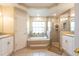 Double vanity bathroom with soaking tub and shower at 3 Seabridge Dr, Ormond Beach, FL 32176