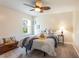 Comfortable bedroom with neutral decor, carpet floors and natural light from the window at 3 Seabridge Dr, Ormond Beach, FL 32176