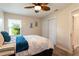 Tranquil bedroom featuring neutral walls, ceiling fan, large window and closet with a warm ambiance at 3 Seabridge Dr, Ormond Beach, FL 32176