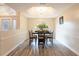 Elegant dining room featuring a wood-look floor and arched window at 3 Seabridge Dr, Ormond Beach, FL 32176