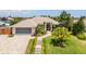Attractive home exterior with landscaped yard and paved driveway at 3 Seabridge Dr, Ormond Beach, FL 32176