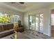Gathering room with sliding doors opening to the pool area at 3 Seabridge Dr, Ormond Beach, FL 32176
