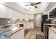 Modern kitchen with granite countertops, white cabinets and stainless steel appliances at 3 Seabridge Dr, Ormond Beach, FL 32176