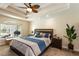 Serene main bedroom featuring a tray ceiling, large windows, and access to the lanai at 3 Seabridge Dr, Ormond Beach, FL 32176