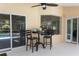 Small patio table and chairs set near pool access at 3 Seabridge Dr, Ormond Beach, FL 32176