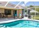 Relaxing pool area with screened enclosure and patio furniture at 3 Seabridge Dr, Ormond Beach, FL 32176