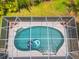 An aerial view of a screened-in swimming pool at 3 Seabridge Dr, Ormond Beach, FL 32176