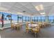 Bright dining room with beautiful coastal views and comfortable seating for residents to enjoy meals at 1239 Ocean Shore Blvd # 7E5, Ormond Beach, FL 32176