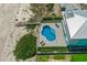 Aerial shot of a beachfront home with a private pool, direct beach access, and lush landscaping at 4711 S Atlantic Ave, Ponce Inlet, FL 32127