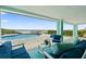 Coastal patio with ocean views, featuring comfortable seating and access to a private pool and the beach at 4711 S Atlantic Ave, Ponce Inlet, FL 32127