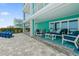 Outdoor patio with blue and white seating, offering a relaxing space to enjoy the beautiful coastal surroundings at 4711 S Atlantic Ave, Ponce Inlet, FL 32127