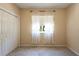 Cozy bedroom with a window for natural light and a closet for storage at 5701 John Anderson Hwy, Flagler Beach, FL 32136