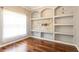 Living room showcases beautiful hardwood floors and custom shelving at 5701 John Anderson Hwy, Flagler Beach, FL 32136