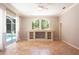 Large living space with tile floors, a built-in shelf, and sliding glass doors with pool access at 5701 John Anderson Hwy, Flagler Beach, FL 32136