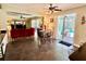 Living room adjacent to the kitchen boasts a patio view with a pool and comfortable seating area at 28 Dormer Dr, Ormond Beach, FL 32174