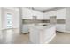 Modern kitchen with white cabinets and center island at 1245 Champions Dr, Daytona Beach, FL 32124