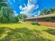 Large backyard with green grass and a home at 1119 Indigo Rd, Ormond Beach, FL 32174