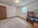 This bedroom features a window and a built-in shelving unit with an attached desk at 1119 Indigo Rd, Ormond Beach, FL 32174