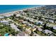 Aerial view of a coastal neighborhood with beach proximity, highlighting the house with a red arrow and its location at 10 Juniper Dr, Ormond Beach, FL 32176