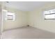 Sunlit bedroom featuring two windows and neutral walls ready for customization at 10 Juniper Dr, Ormond Beach, FL 32176