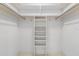 Walk-in closet features built-in shelving and ample storage at 10 Juniper Dr, Ormond Beach, FL 32176