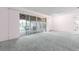 Bright living room featuring sliding glass doors to the porch at 10 Juniper Dr, Ormond Beach, FL 32176