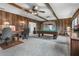 Spacious home office or game room with a pool table, ceiling beams, and wood paneling at 10 Juniper Dr, Ormond Beach, FL 32176